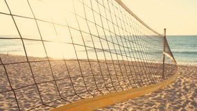 Volleyball net and beautiful sunrise on the beach 