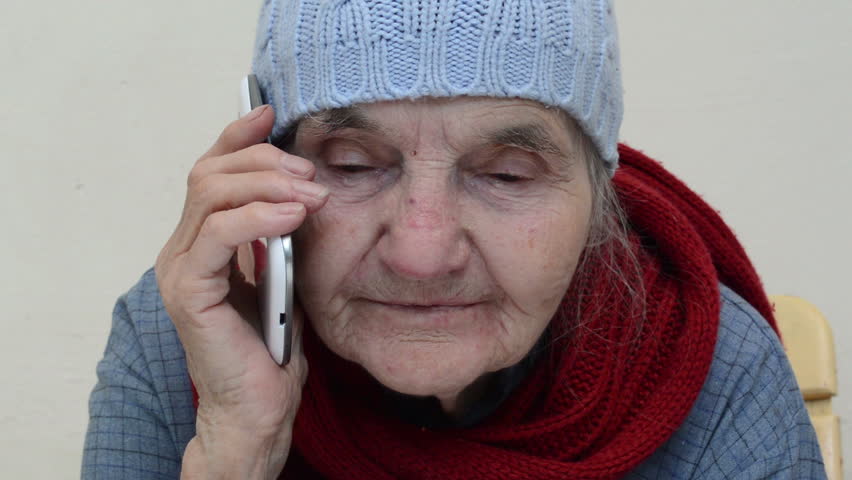 Old woman talking on smart phone