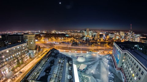 Kharkiv city from above at night winter timelapse. Aerial view of the city center and freedom square. Ukraine.