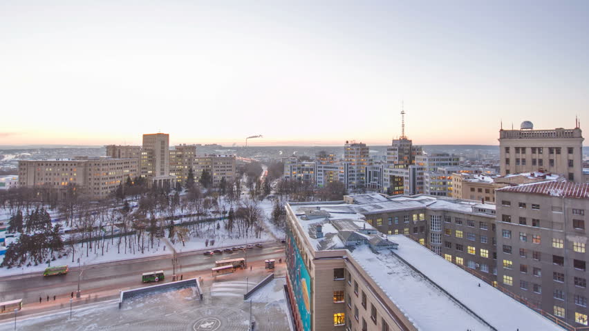 Kharkiv city from above day to night transition winter timelapse. Aerial view of the city center and freedom square. Ukraine.