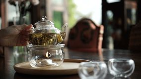 Beautiful flower tea serve in glass pot and cup video