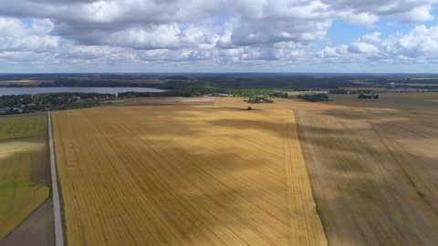Aerial hyperlapse of shadows arriving over a crop field