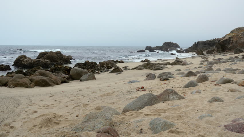 Small Sand Beach with Large Rocks in California