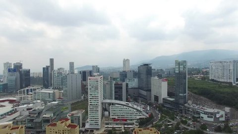 MEXICO CITY, MEXICO - CIRCA JUNE 2017: Aerial panoramic view of Santa Fe Financial District in Mexico City with drone flying forward