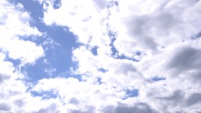Beautiful Clouds blue sky flying of white fluffy in daytime on clear summer day, time lapse clip