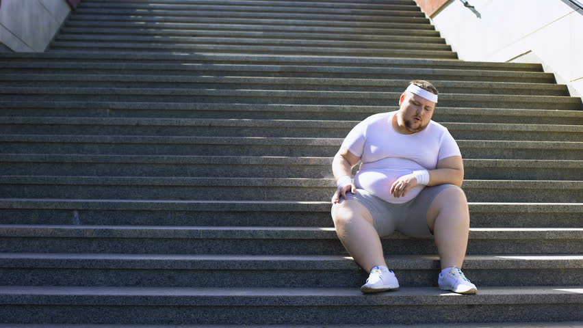 Obese Man Sitting Down On Stock Footage Video 100 Royalty Free 1014982981 Shutterstock