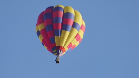 BRISTOL - August 11: Hot Air Balloon Flying Overhead against Blue Sky at Bristol Balloon Fiesta 2018, on August 11 2018 in Bristol, England