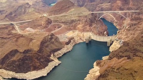 landscape and infrastructure and concept - aerial view of hoover dam and mike callaghan - pat tillman memorial bridge over colorado river at grand canyon from helicopter