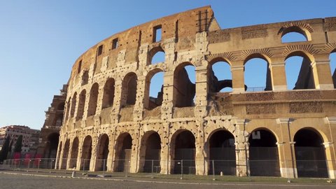 Famous Italian attraction Colosseum in Rome. Veiw on ancient Flavius amphitheater Coliseum in capital of Italy. Camera moving from left to right