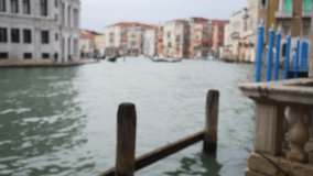 Blurred shot of rustic Italian homes on the Grand Canal in late afternoon. Defocused background plate of traditional Venice architecture and canal. 4k