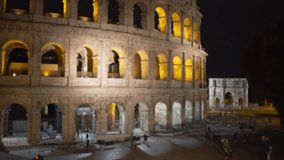 Night shot of ancient ruin in old European city. Closeup view of Roman Colosseum arches in Rome Italy in the evening
