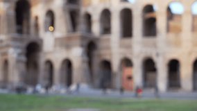Close up of blurred facade of ancient colosseum in old European city. Out of focus background plate of Roman Colosseum in Rome Italy