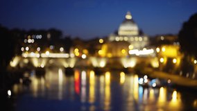 Pretty out of focus shot of Saint Peters Basilica in Vatican City in Rome Italy. Lovely blurred view of the Saint Angel bridge across the Tiber River