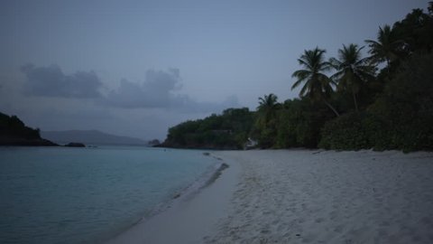 Twilight shot of the Caribbean shore for green screen or chroma key. Out of focus or defocused background plate.