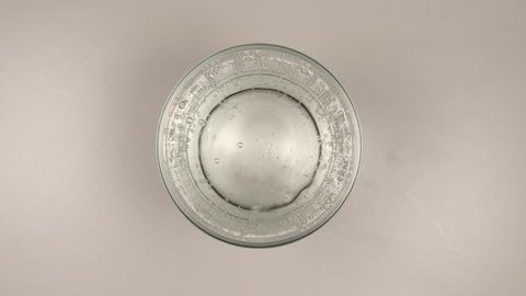 TOP VIEW: Drinking a fresh mineral water - Stop motion