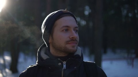 Close up portrait of young man in a winter wood