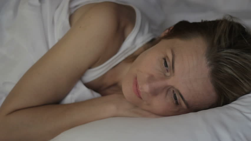 Thoghtful, lonely, upset woman can not fall asleep, having problems with sleep Royalty-Free Stock Footage #1015039765