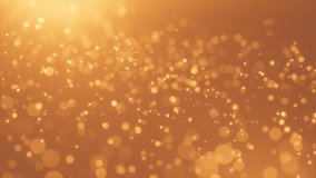 4K Abstract festive gold motion background with defocused round bokeh lights. Golden particle shine. Xmas 2019