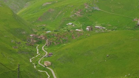 Up view of ancient Ossetian village with ruined houses and family fortress