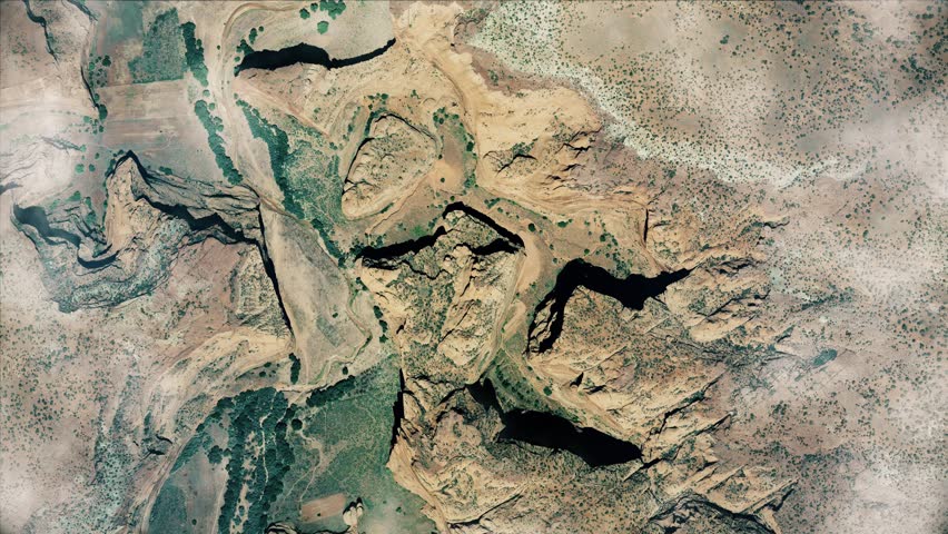 Airplane flying above Grand Canyon. Mountains top view.