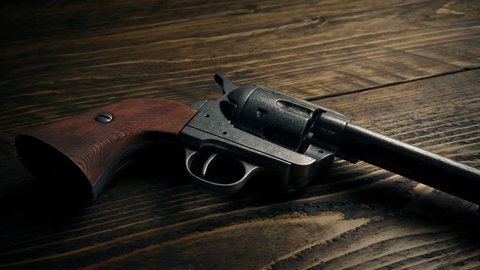 Cowboy Gun Picked By Gloved Hand