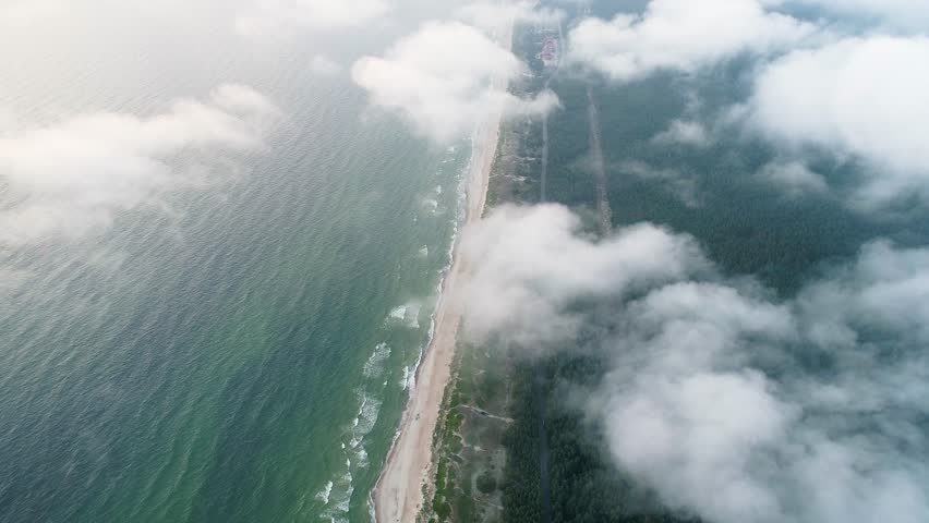 flight over clouds at seashore
