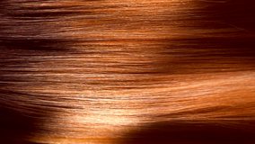 Hair. Beautiful healthy long smooth flowing brown hair close-up texture. Dyed straight hair background, coloring, extensions, cure, treatment concept. Haircare. Slow motion 4K UHD video