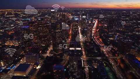 Aerial city connected through 5G. Wireless network, mobile technology concept, data communication, cloud computing, artificial intelligence, internet of things. Los Angeles skyline. Futuristic city.