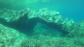 Rock formation underwater natural arch in the Mediterranean sea, Catalonia, Cap de Creus, Costa Brava, Spain