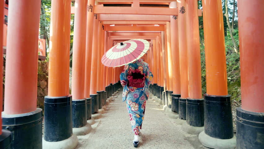 Asian women in traditional japanese kimonos walking at Fushimi Inari Shrine in Kyoto, Japan. 4K Royalty-Free Stock Footage #1015069222