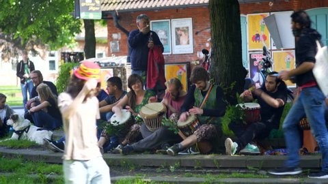 GERMANY - CIRCA MAY 2017 - Hippie alternative drummers play music at park, march against Monsanto, Hamburg