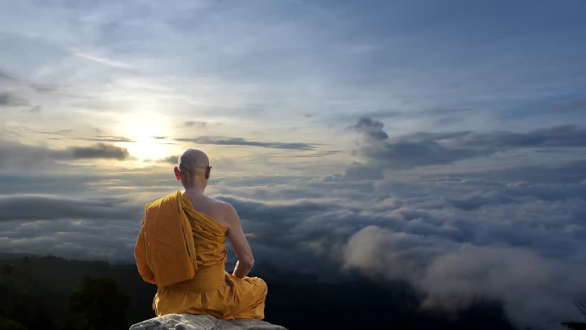 Buddhist monks in meditation on the hill In the mist at sunrise. Royalty-Free Stock Footage #1015119313