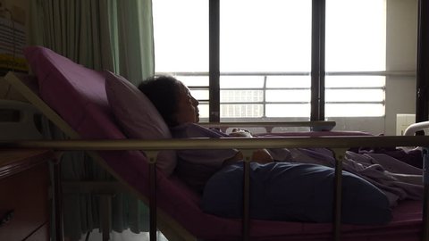 senior woman patient lying in sickbed at hospital