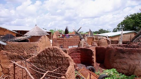Ghana, West Africa - 2018: A village compound made of earth, straw and corrugated iron sheets in northern Ghana.