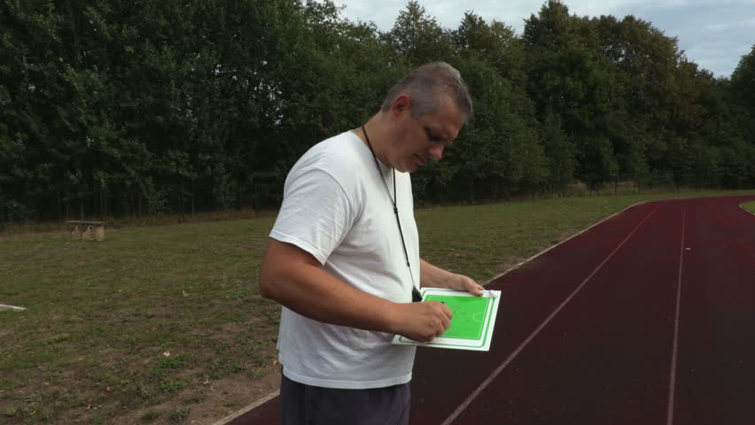 Coach during the game gives instructions to the players