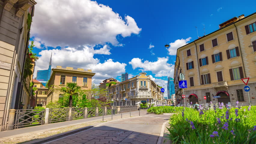 sunny day milan city old town traffic street modern block panorama 4k timelapse italy