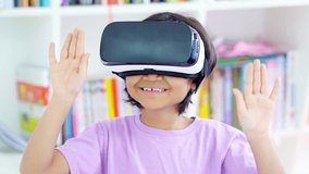 Child with virtual reality standing in the library while gesturing with her hands. Shot in 4k resolution