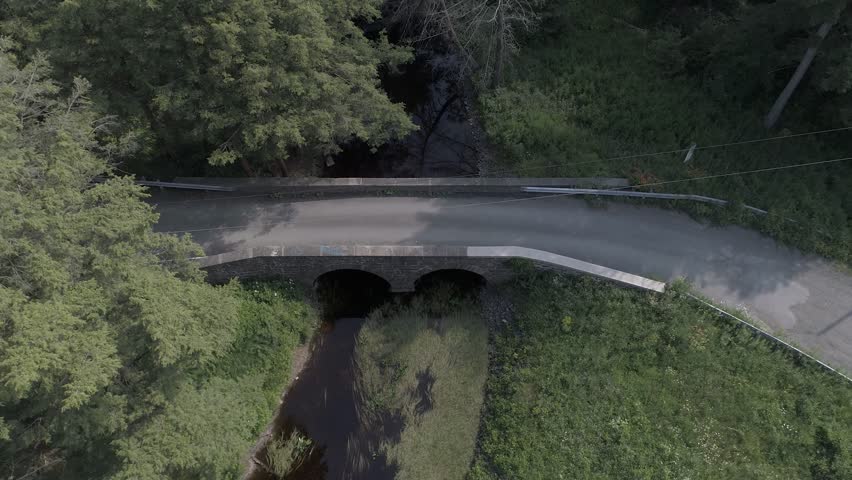 Northern Pennsylvania Car driving over Stone bridge 