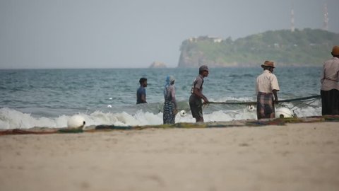 Trincomalee/Sri Lanka- July 2018: fishermen pull the net