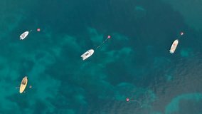 Aerial view on boat in blue colorfull sea with nice waves. Aerial 4K video nature.