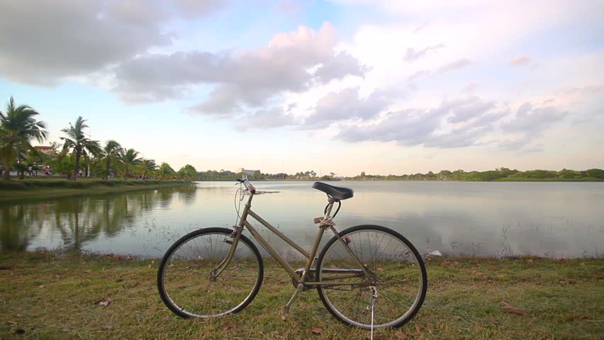 Bike for life , a bicycle with sweet clouds moving on the sky
