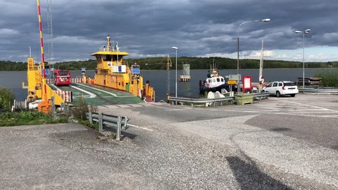 ADELSÖ - AUGUST 18, 2018: The Car Ferry Between Adelso and Ekero in Stockholm, Sweden loading up.