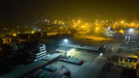 night time illuminated shenzhen city famous working port aerial panorama 4k tilt shift timelapse china
