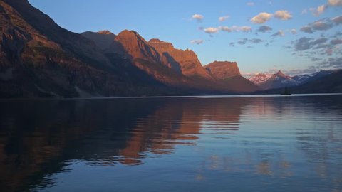 This is a panning view of St Mary Lake in Glacier National Park at sunrise hour