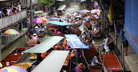 Ratchaburi-Thailand Aug 11 2018: Damnoen Saduak floating market in thailand,Traffic jam with tourist people on rowboat in river canal.