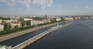 4K aerial sunny day video view of Saint Petersburg's old center embankment area, Neva River panorama, historical golden domes cathedral near Finnish Bay and surroundings of Russia's northern capital