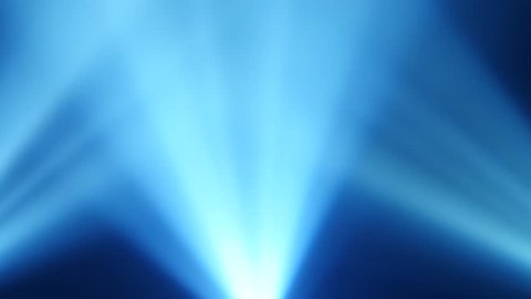 Rays of blue light from searchlights on a black smoke background