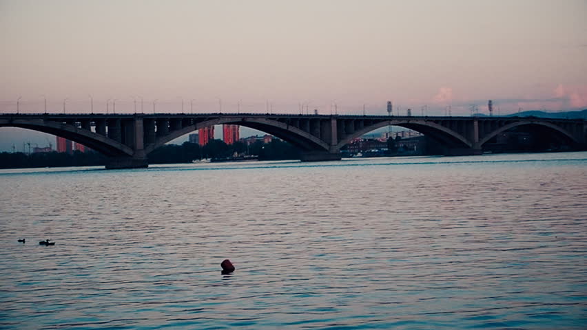 urban landscape with a view of the river bridge and fountains