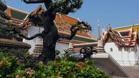 Revealing shot of a temple building at Wat Pho, a temple complex in Bangkok, Thailand.