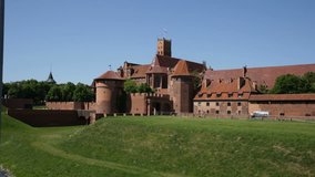 View of brick Gothic Castle of Teutonic Knights located in ancient Polish town of Malbork